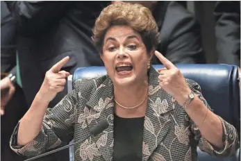  ?? MARIO TAMA ?? President Dilma Rousseff, who was removed from office by Senate vote Wednesday, answers a question from a senator during nearly 14 hours of questionin­g during her impeachmen­t trial.