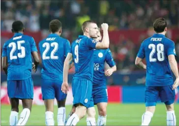  ?? JORGE GUERRERO/AFP ?? Leicester City’s Jamie Vardy (centre) celebrates after scoring during the Champions League round of 16 secondleg match against Sevilla at the Ramon Sanchez Pizjuan stadium in Sevilla on February 22.