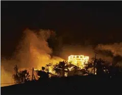  ?? Spencer Weiner Los Angeles Times ?? HOMES BURN in Malibu on Jan. 8, 2007. Fanned by Santa Ana winds, the fire destroyed several oceanfront houses and damaged others.