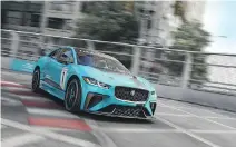  ??  ?? An I-Pace concept car intended for Jaguar’s new all-electric eTrophy race series is shown going through its paces.