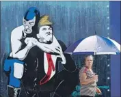  ?? Luis Sinco Los Angeles Times ?? A BOYLE HEIGHTS mural shows a lucha libre wrestler putting Donald Trump in a headlock.