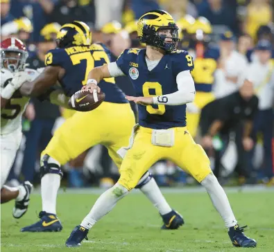  ?? HARRY HOW/GETTY ?? If J.J. McCarthy does not return to Michigan next season, he will make an intriguing quarterbac­k prospect in April’s NFL draft.
