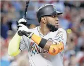  ?? MATT YORK/AP ?? Marcell Ozuna, above, and teammate Giancarlo Stanton were named National League co-players of the week.