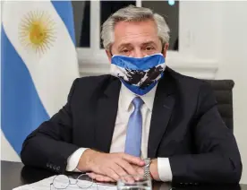  ??  ?? President Alberto Fernández of Argentina has gone into voluntary isolation. Photograph: Esteban Collazo/Argentina's Presidency Press Off/AFP/Getty Images