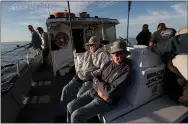  ??  ?? Passengers fish for salmon aboard the “Wacky Jacky” on a Wednesday — regulars’ day — in September.