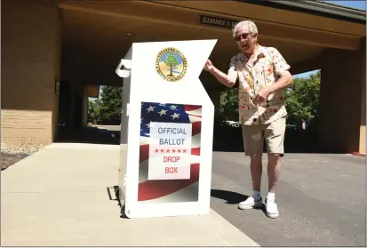  ?? PHOTOS BY KIMBERLY MORALES — ENTERPRISE-RECORD ?? Clive Evans drops off his ballot into the ballot drop box outside of the Chico Masonic Family Center in Chico.