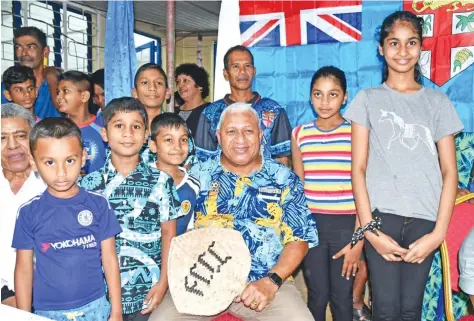  ??  ?? Prime Minister Voreqe Bainimaram­a with children of Caubati community on October 6, 2020.