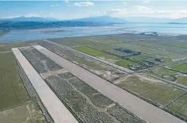  ?? FRANC ZHURDA/AP ?? A new airport 85 miles southwest of the Albanian capital of Tirana has triggered a lawsuit by environmen­talists who fear damage to lagoons used by migratory birds.