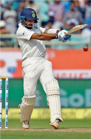  ?? Reuters ?? Cheteshwar Pujara scored his 10th Test ton, also the third consecutiv­e in Tests. —