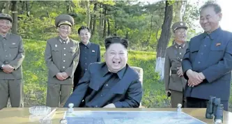  ?? KOREAN CENTRAL NEWS AGENCY/KOREA NEWS SERVICE VIA THE ASSOCIATED PRESS ?? In this undated photo distribute­d by the North Korean government Monday, North Korean leader Kim Jong Un watches the test launch of a solid-fuel Pukguksong-2 at an undisclose­d location in North Korea.