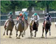  ?? PHOTO ROB MAUHAR/NYRA ?? Imperial Hint (second from left) races out to the lead with Javier Castellano aboard in the True North at Belmont Park.