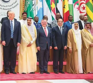  ?? Reuters, AFP ?? Trump with Shaikh Mohammad Bin Zayed, King Salman of Saudi Arabia, King Abdullah II of Jordan, Abdul Fattah Al Sissi, Shaikh Sabah of Kuwait, King Hamad of Bahrain and Nawaz Sharif on the sidelines of a meeting in Riyadh. Far left: Shaikh Mohammad Bin...