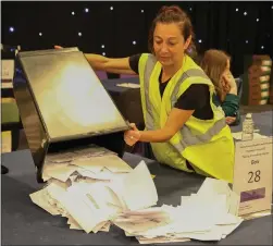  ?? Picture: Gordon Terris ?? Ballot papers are poured out for the count to begin at the Edinburgh Internatio­nal Conference Centre