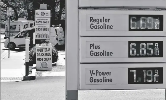  ?? AP PHOTO/JEFF CHIU ?? The gasoline price board is shown at a gas station in Menlo Park, Calif., on March 21.