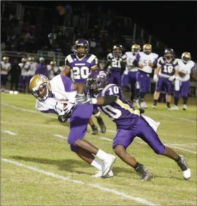  ?? News-Times/Terrance Armstard ?? Making the tackle: Junction City's Dhante Gibson tries to bring down Osceola's Trayveon Moore during their showdown in the 3A semifinals last week at David Carpenter Stadium. After meeting in the seoond round of the playoffs last year, Junction City...