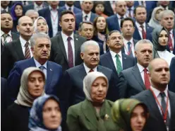  ?? —AFP ?? ANKARA: Turkish Prime Minister Binali Yildirim looks on during the 115th enlarged meeting of provincial chairmen of Justice and Developmen­t Party (AKP) at the AK Party’s headquarte­rs in Ankara, yesterday.