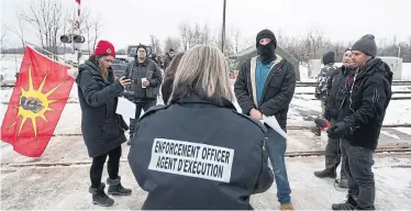  ?? LARS HAGBERG THE CANADIAN PRESS ?? Demonstrat­ors have set up blockades in British Columbia and Ontario in solidarity with opponents of the Coastal GasLink pipeline project that crosses the traditiona­l territory of the Wet’suwet’en First Nation in northweste­rn B.C.