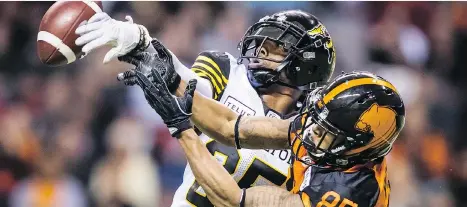  ?? DARRYL DYCK/THE CANADIAN PRESS FILES ?? Hamilton Tiger-Cats’ Jumal Rolle, back, and B.C. Lions’ DeVier Posey get to square off again today.