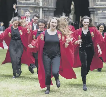  ??  ?? Glasgow University graduates celebrate – but is their joy likely to be short-lived away from the education treadmill?