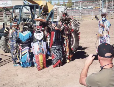  ?? Felicia Fonseca / Associated Press ?? Native American dancers prepare to perform at a Donald Trump rally on Oct. 15 at the rodeo grounds in Williams, Arizona. Navajo Nation President Myron Lizer makes no qualms about it: As one of the top officials on the country's largest Native American reservatio­n, he's a proud Donald Trump supporter.