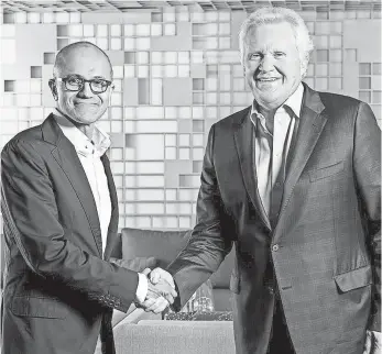  ?? BRIAN SMALE ?? Jeff Immelt, right, with Microsoft CEO Satya Nadella, will remain as GE chairman until Dec. 31.