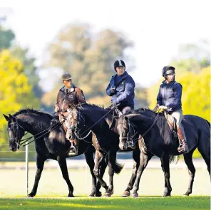  ?? ?? Prince Andrew, centre, returns to riding at Windsor Castle after spending the summer at Balmoral