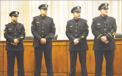  ?? Cassandra Day / Hearst Connecticu­t Media ?? Four Middletown police officers were promoted Friday in a ceremony at City Hall Council Chambers. From left are Sgts. Dale Rowland, Michael Inglis and Derek Puorro, and Lt. David Godwin.