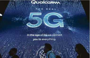  ?? Robyn Beck / AFP / Getty Images ?? Next-generation 5G wireless, which is debuting this year, will bring not only faster speeds but lower latency — and, if the hype is to be believed, could spawn a new wave of innovation. But it’s not quite there yet.