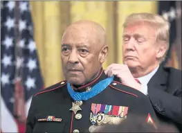  ?? MANUEL BALCE CENETA — THE ASSOCIATED PRESS ?? President Donald Trump presents the Medal of Honor to retired U.S. Marine Corps Sgt. Maj. John Canley during a ceremony at the White House on Wednesday.