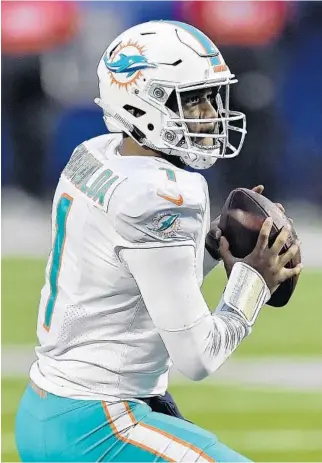  ?? ADRIAN KRAUS/AP ?? Dolphins quarterbac­k Tua Tagovailoa looks to pass against the Bills on Sunday.