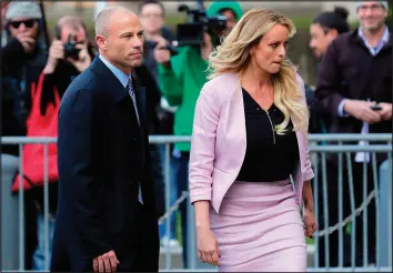  ?? SETH WENIG / ASSOCIATED PRESS FILE (2018) ?? Stormy Daniels, right, and attorney Michael Avenatti turn from the microphone­s after speaking April 16, 2018, as they leave federal court in New York. Daniels has faced many forms of harassment in the time since she entered the public eye in her legal battles against former President Donald Trump.