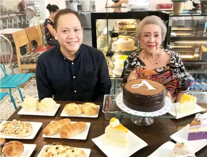  ?? SUNSTAR FOTO / MARYMIL M. CABRERA ?? IN WITH THE NEW. To appeal to a younger crowd, Anita’s is offering an upscale store. The 50-year-old bakeshop was founded by Anita Cabinian (right). Her son Benjamin (left) now manages it.