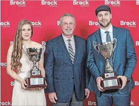  ?? MICHAEL P. HALL BROCK UNIVERSITY ?? Athletes of the year Jessica Brouillett­e, left, and Clint Windsor flank Brock University athletic director Neil Lumsden.