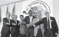  ?? Associated Press ?? Internatio­nal Boxing Hall of Fame Class of 2017 inductees, from left, Steve Farhood, Barry Tompkins, Marco Antonio Barrera, Evander Holyfield, Jerry Roth and Johnny Lewis display their rings following the induction ceremony Sunday in Canastota, N.Y.