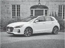  ?? DEREK MCNAUGHTON/ DRIVING ?? The Elantra GT hatchback costs a bit more than its sedan stablemate but is worth it.