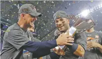  ?? DAVID J. PHILLIP/ASSOCIATED PRESS FILE PHOTO ?? Astros manager A.J. Hinch, left, and Jose Altuve hold the ALCS trophy Oct. 21 after beating the Yankees in Houston. Altuve was named The Associated Press Male Athlete of the Year on Wednesday.