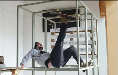  ??  ?? Performanc­e artist Conor McDonald adds an unusual angle to the Gorey Skate Park tenth anniversar­y exhibition which ran at Gorey Library last week.