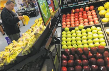  ?? Andy Wong / Associated Press ?? Apples imported from the United States are displayed at a supermarke­t in Beijing.