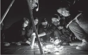  ?? Allen J. Schaben
/ Los Angelestim­es ?? Mourners take part in a vigil for the victims of a mass shooting at the Star Dance Studio on Monday in Monterey Park.