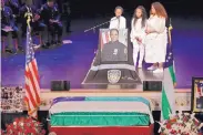  ?? RICHARD DREW/ASSOCIATED PRESS ?? Peter Vega, left, Genesis Villella, right, and Delilah Vega, children of New York City Police Officer Miosotis Familia, attend their mother’s funeral in New York on Tuesday.