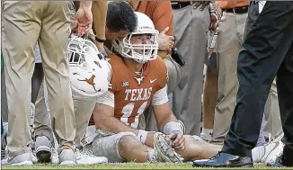  ?? JAY JANNER / AMERICAN-STATESMAN ?? UT quarterbac­k Sam Ehlinger, shaken up after a hit by OU’s Kenneth Murray on Saturday, left the field, was evaluated and returned after a brief appearance by backup Shane Buechele.