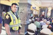  ?? PTI ?? Javed Khan stands guard at the temple in Indianapol­is.