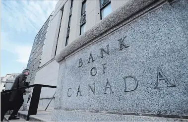  ?? SEAN KILPATRICK THE CANADIAN PRESS ?? Stephen Poloz, Bank of Canada governor, returns to the bank after a news conference in October. On Wednesday, the bank left its trend-setting rate at 1.75 per cent.