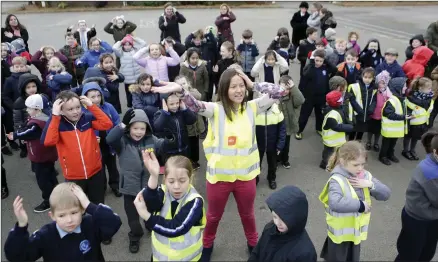  ??  ?? Frankie Brady leads the second class pupils in the Macarena.