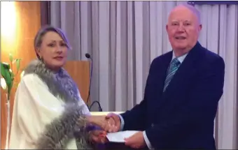  ??  ?? Gail McGibbon, CEO of Sligo Business Improvemen­t District (BID) presenting a cheque to Chairman of Sligo Tidy Towns Peter Tiernan on behalf of all Bid Companies. BID is now the main funder of Tidy Towns.