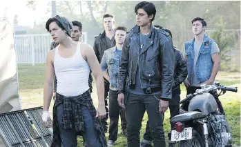  ?? THE CW ?? Jordan Connor, in his Sweet Pea leather jacket, backs up a tank-topped Jughead Jones, played by Cole Sprouse, during an episode of Riverdale.