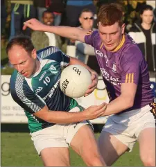  ??  ?? Peter Walsh (Volunteers) under pressure from John Doyle.