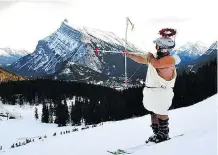  ??  ?? Cupid takes aim at Mount Norquay during the Lifts of Love, a speed dating event with a twist that’s capped with an apres ski mixer.