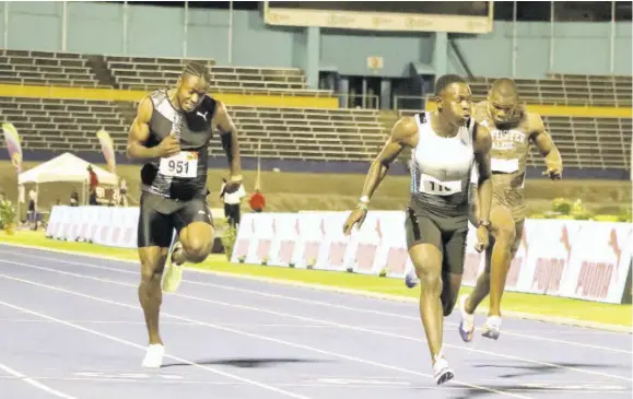  ?? (Photo: Dwayne Richards) ?? Oblique Seville (centre) wins the men’s 100m final in a personal best 10.00s, ahead of Kishane Thompson (left) 10.21s and Kadrian Goldson (right) 10.27s at the JAAA/SDF Jubilee Series Meet at the National Stadium in Kingston last Saturday.