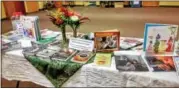  ?? SUBMITTED PHOTO — FOR DIGITAL FIRST MEDIA ?? Books are on display at the Soueidans’ meal they held for the Salford Mennonite Church congregati­on on Sept. 17.